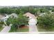 A bird's eye view of a home, highlighting its lush landscaping and location at 807 Wolf Creek St, Clermont, FL 34711