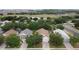 An aerial view of the home, showing its manicured lawn and peaceful surroundings at 807 Wolf Creek St, Clermont, FL 34711