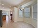 Bright dining area features tile floors, a bay window and decorative chandelier at 807 Wolf Creek St, Clermont, FL 34711