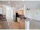 Bright kitchen with stainless steel refrigerator and sink with breakfast bar at 807 Wolf Creek St, Clermont, FL 34711