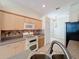 Kitchen with modern appliances and a view into the breakfast nook at 807 Wolf Creek St, Clermont, FL 34711