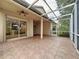 Expansive screened lanai with tile flooring and ceiling fans, perfect for outdoor entertaining and relaxation at 807 Wolf Creek St, Clermont, FL 34711