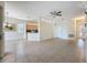 Open-concept living area with tile flooring and an adjoining kitchen at 807 Wolf Creek St, Clermont, FL 34711