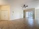 Spacious living room with neutral colors, tile floors, and ceiling fan at 807 Wolf Creek St, Clermont, FL 34711
