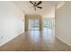 Expansive living room boasts tile flooring and views of the screened lanai through sliding glass doors at 807 Wolf Creek St, Clermont, FL 34711