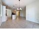 Open floor plan connecting kitchen and dining area with lots of light at 807 Wolf Creek St, Clermont, FL 34711