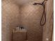 Bathroom shower with beige tiling, a built-in corner shelf, and a modern shower head at 8091 C 476B, Bushnell, FL 33513