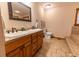 Bathroom with double vanity, tile floor, and a separate toilet area at 8091 C 476B, Bushnell, FL 33513