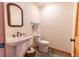Bathroom with a pedestal sink, an ornate mirror, and tile flooring creating a classic and functional space at 8091 C 476B, Bushnell, FL 33513