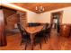 Cozy dining room with a wooden table, chairs, and a chandelier at 8091 C 476B, Bushnell, FL 33513