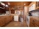 Functional kitchen featuring wooden cabinets, tiled countertops, and ample counter space at 8091 C 476B, Bushnell, FL 33513