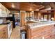 Beautiful kitchen with wooden cabinets, tiled countertops, and modern appliances at 8091 C 476B, Bushnell, FL 33513