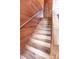 Wooden staircase featuring wooden panels and stone accents at 8091 C 476B, Bushnell, FL 33513