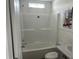 Clean bathroom with a shower-tub combo, white vanity, and toilet at 811 N Swindell #2 Ave, Lakeland, FL 33810
