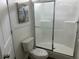 Bathroom featuring a toilet with 'Do Not Use' sign and white shower with sliding glass door at 811 N Swindell #2 Ave, Lakeland, FL 33810