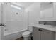 Bathroom featuring tub/shower combo and sink with gray cabinets and wood look flooring at 811 N Swindell #2 Ave, Lakeland, FL 33810