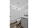 Bathroom featuring tub/shower combo and sink with gray cabinets and wood look flooring at 811 N Swindell #2 Ave, Lakeland, FL 33810