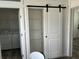 Bedroom closet with sliding barn door located next to the laundry room at 811 N Swindell #2 Ave, Lakeland, FL 33810