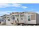 Inviting manufactured home with a welcoming porch, perfect for relaxing and enjoying the outdoors at 811 N Swindell #2 Ave, Lakeland, FL 33810