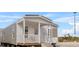 Charming manufactured home with a cozy porch and neutral siding, blending comfort and style at 811 N Swindell #2 Ave, Lakeland, FL 33810