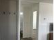 Hallway featuring neutral walls, modern flooring, and access to a bathroom at 811 N Swindell #2 Ave, Lakeland, FL 33810