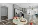 Modern kitchen with stainless steel appliances, grey cabinets, kitchen island and dining area at 811 N Swindell #2 Ave, Lakeland, FL 33810
