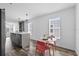 Kitchen island with grey cabinets, stainless steel sink and faucet and a dining area nearby at 811 N Swindell #2 Ave, Lakeland, FL 33810