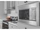 Close-up of a modern kitchen with stainless steel appliances and stylish gray cabinetry at 811 N Swindell #2 Ave, Lakeland, FL 33810