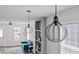 Bright living room featuring stylish pendant lights and a comfortable blue sofa at 811 N Swindell #2 Ave, Lakeland, FL 33810