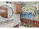 Bathroom featuring a granite countertop and a novelty shower curtain at 830 Palm Harbor Ct, Leesburg, FL 34748