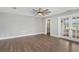 Bright bedroom with access to closet and outdoor patio space at 830 Palm Harbor Ct, Leesburg, FL 34748