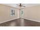 Bedroom with luxury vinyl plank flooring and backyard access at 830 Palm Harbor Ct, Leesburg, FL 34748