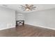 Spacious bedroom with wood-look flooring and modern ceiling fan at 830 Palm Harbor Ct, Leesburg, FL 34748