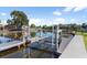Multiple boat lifts on the waterway for easy access to aquatic adventures and recreation at 830 Palm Harbor Ct, Leesburg, FL 34748