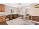 Well-lit dining room featuring wood accents, a rustic cabinet, and natural light at 830 Palm Harbor Ct, Leesburg, FL 34748