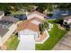 Charming waterfront home with a well-manicured lawn and lovely landscaping at 830 Palm Harbor Ct, Leesburg, FL 34748