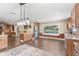 A spacious kitchen with an island, stainless appliances and a gorgeous lake view at 830 Palm Harbor Ct, Leesburg, FL 34748