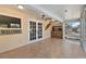 Inviting sunroom with tiled floor and large windows overlooking the water, perfect for relaxation and entertaining at 830 Palm Harbor Ct, Leesburg, FL 34748