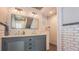 Elegant bathroom with subway tiles, double vanity, and modern fixtures, offering a comfortable experience at 908 N Tremain St, Mount Dora, FL 32757