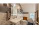 Charming bathroom with a pedestal sink, subway tile, and black and white mosaic tile flooring at 908 N Tremain St, Mount Dora, FL 32757