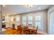 Dining room boasting natural light, hardwood floors, and seamlessly connects to the updated kitchen at 908 N Tremain St, Mount Dora, FL 32757