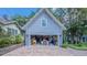 Spacious garage interior with storage space for tools and equipment and a well-lit workspace at 908 N Tremain St, Mount Dora, FL 32757