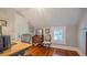 Functional home office with hardwood floors, natural light, and ample workspace for productivity at 908 N Tremain St, Mount Dora, FL 32757