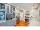 Modern kitchen featuring stainless steel appliances, marble backsplash, and ample cabinet space at 908 N Tremain St, Mount Dora, FL 32757