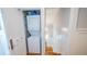 Conveniently located stacked washer and dryer unit on a staircase landing at 908 N Tremain St, Mount Dora, FL 32757