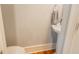 A compact powder room featuring a pedestal sink and wood flooring at 908 N Tremain St, Mount Dora, FL 32757