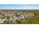 Extensive neighborhood with manicured lawns and diverse home styles showcases a vibrant community setting at 1016 Pickering Path, The Villages, FL 32163