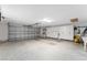 Spacious garage with ample storage cabinets and high ceilings at 1016 Pickering Path, The Villages, FL 32163