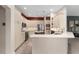 Kitchen with ample cabinetry, stainless steel appliances, and a convenient center island at 1016 Pickering Path, The Villages, FL 32163
