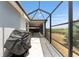 Covered and screened lanai provides outdoor dining with backyard views at 1016 Pickering Path, The Villages, FL 32163